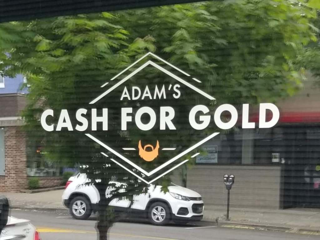 adams cash for gold logo on window