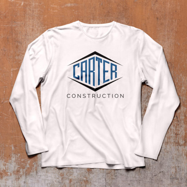 Carter construction logo on white long sleeve shirt on wood background