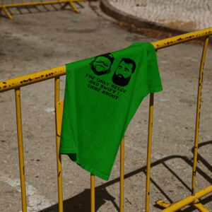 Mockup of Jason Kelce and D'andre swift tee shirt on yellow road barrier